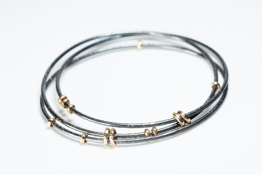 Interlocking Sterling and Gold Bangle